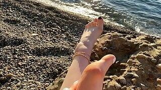 Domina Lara plays with her soles and toes on the beach