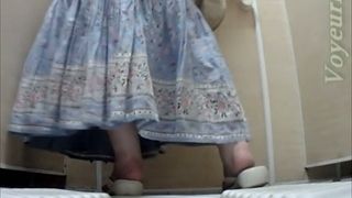 White mature lady in dress pisses in the toilet room